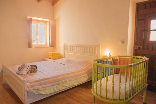 Postel nebo postele na pokoji v ubytování Casa das Romãs