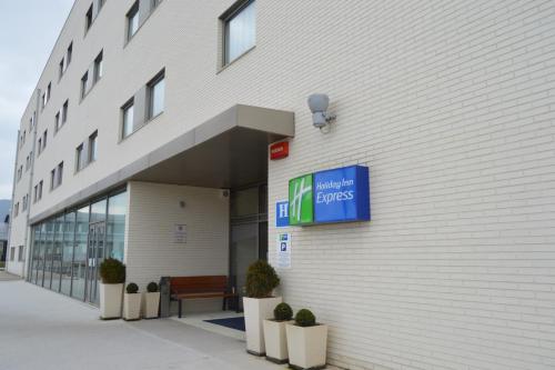 a building with a sign on the side of it at Holiday Inn Express Vitoria by IHG in Vitoria-Gasteiz