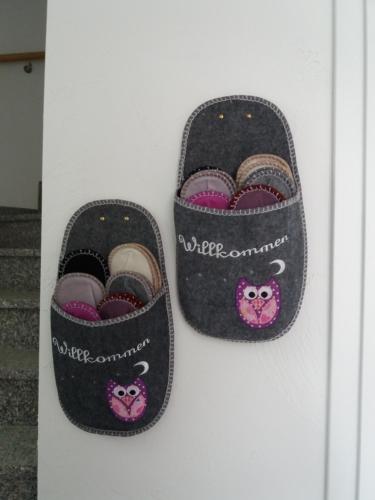two slippers with a hello kitty inside of them at Gästehaus Am Hochsimmer in Ettringen