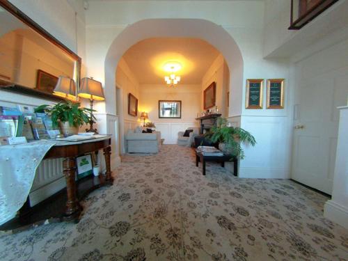 a large room with a hallway with a living room at Carlingford House Town House Accommodation A91 TY06 in Carlingford