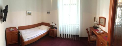 Hotel Pegas Brno tesisinde bir odada yatak veya yataklar