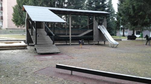 a park with a playground with a slide and a slideintend at Ferienwohnung Heinrich ab 2 Nächte Buchung möglich 1Übernachtung ist nicht möglich in Altenau