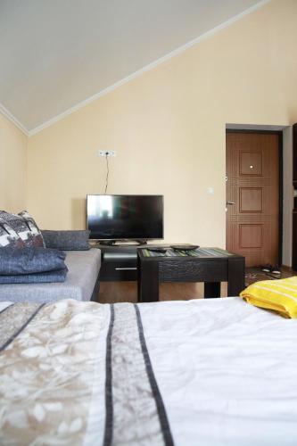 Ένα ή περισσότερα κρεβάτια σε δωμάτιο στο Apartments on Drohobytska 6b