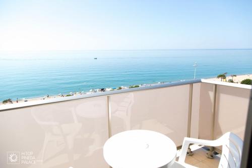 a view of the ocean from the balcony of a condo at htop Pineda Palace 4Sup - Adults Recommended #htopBliss in Pineda de Mar