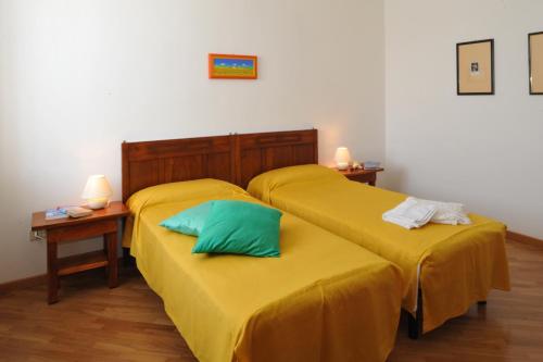 Tempat tidur dalam kamar di Bed & Breakfast Pegaso