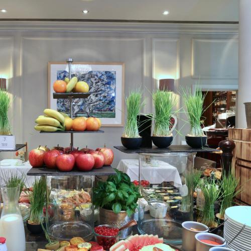 a display of fruits and vegetables on a table at Hotel München Palace in Munich