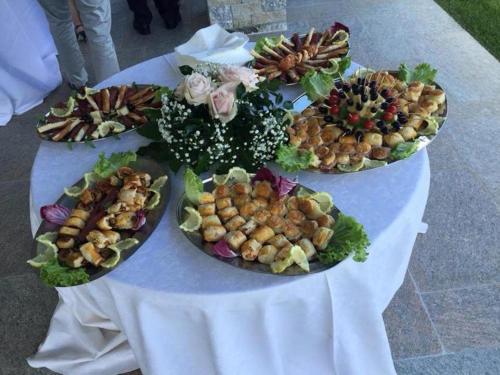 a table with four plates of food on it at Hotel Lumin in Cremia