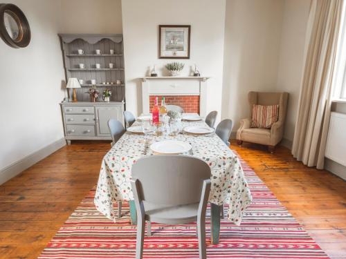a dining room with a table and chairs at Holly Farm in Doddington