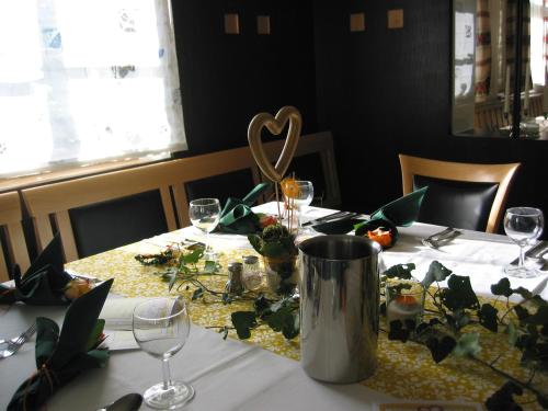 a table with a table cloth with a heart on it at Hotel und Gasthof Ritter St. Georg in Erlangen