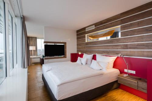 Ein Bett oder Betten in einem Zimmer der Unterkunft Hotel Alte Werft