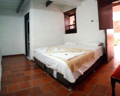 Postel nebo postele na pokoji v ubytování Hotel Central Graciela