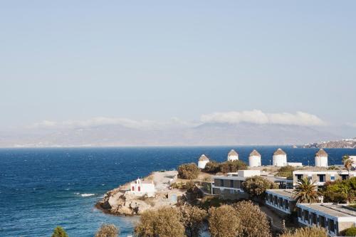an island in the middle of the ocean with houses at Hotel Adonis in Mýkonos City