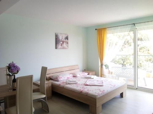 Postel nebo postele na pokoji v ubytování Apartments M&Z