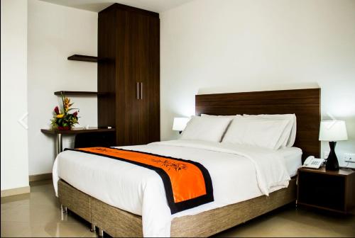 En eller flere senge i et værelse på Casa Murillo Hotel