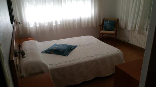 En eller flere senge i et værelse på Hotel A Roda