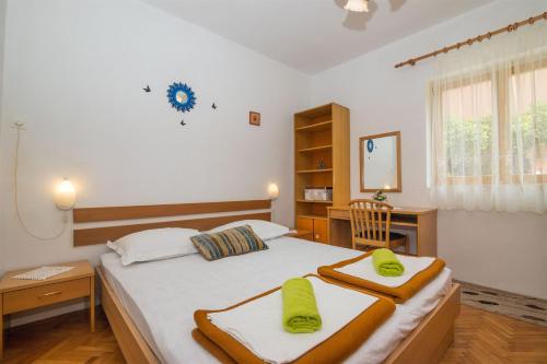 Ένα ή περισσότερα κρεβάτια σε δωμάτιο στο Apartments Ante