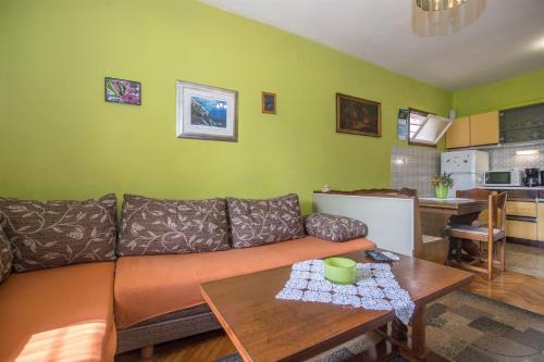a living room with a couch and a table at Apartments Ante in Igrane