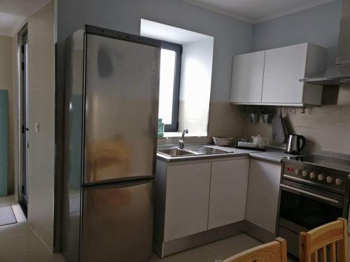 Η κουζίνα ή μικρή κουζίνα στο Long Beach Apartamento AL