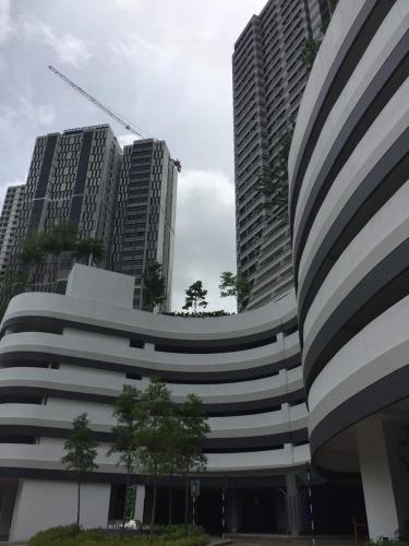 a building with two tall buildings in a city at Meridin Medini Muslim Condo in Nusajaya