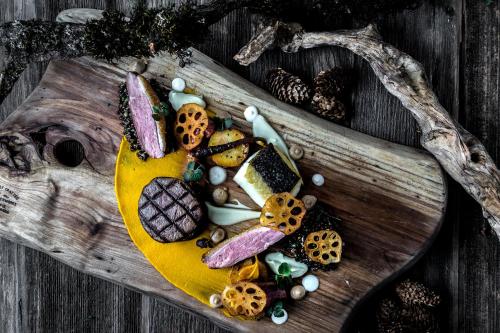 a wooden spoon filled with different types of food at Fairmont Waterfront in Vancouver