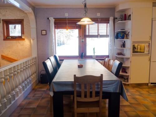 a dining room with a table and chairs at Nordic character in Vidsel