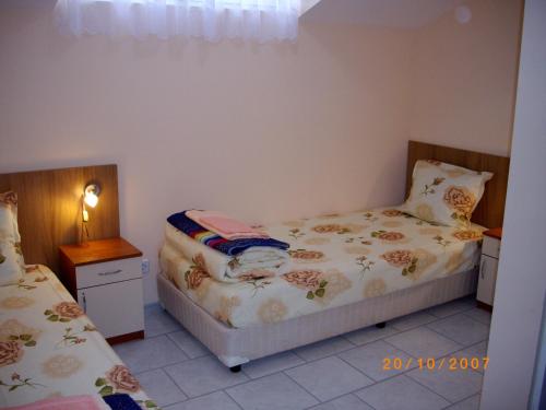 Ένα ή περισσότερα κρεβάτια σε δωμάτιο στο Aleks Guest House