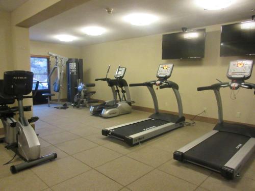 a gym with several exercise bikes and tread machines at Best Western Plus Olympic Inn in Klamath Falls