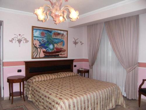 Postel nebo postele na pokoji v ubytování Hotel U' Bais