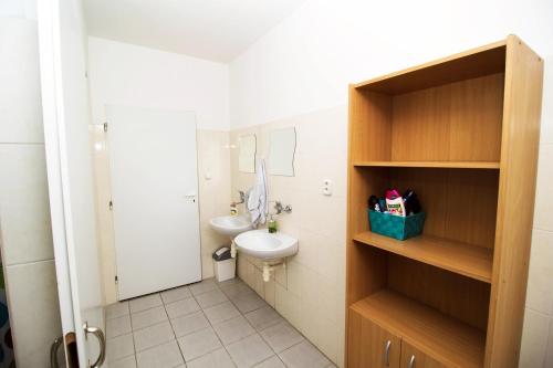 a small bathroom with a toilet and a sink at Nitra Glycerin Hostel in Nitra