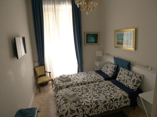A bed or beds in a room at Nori Guest House