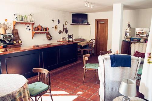 a kitchen with a table and chairs in a room at Hostal Goya II in Carbonero el Mayor
