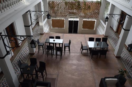 an overhead view of a dining room with tables and chairs at Casa Meba Hotel Boutique in Tampico