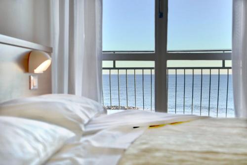 Ένα ή περισσότερα κρεβάτια σε δωμάτιο στο Hotel Mayola Mhotelsgroup