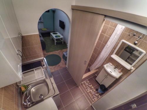 an overhead view of a bathroom with a sink and a mirror at Sleep and Go Pedja in Belgrade