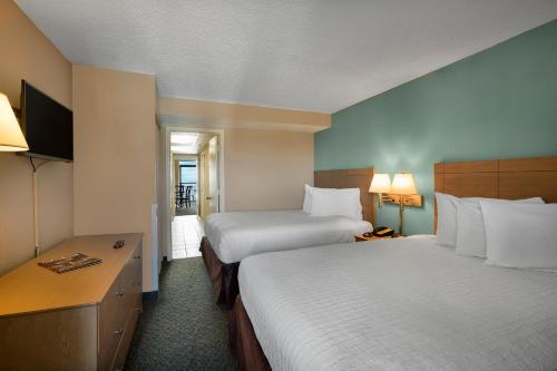 Posteľ alebo postele v izbe v ubytovaní Landmark Resort