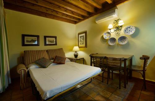 מיטה או מיטות בחדר ב-Alojamientos Turísticos Rurales La Barataria