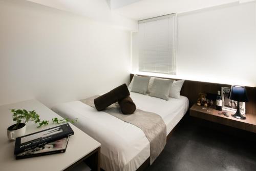 Katil atau katil-katil dalam bilik di Hills Hotel Gotanda
