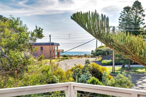 a view from the balcony of a house with a palm tree at Sea View at Silver Sands - C21 SouthCoast Holidays in Aldinga Beach