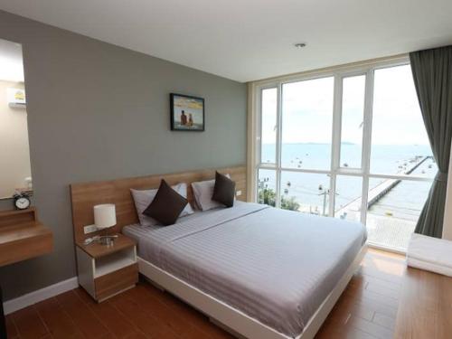Ένα ή περισσότερα κρεβάτια σε δωμάτιο στο BBG Seaside Luxurious Service Apartment