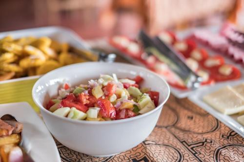 a salad in a white bowl on a table at Wasai Puerto Maldonado Eco Lodge in Puerto Maldonado