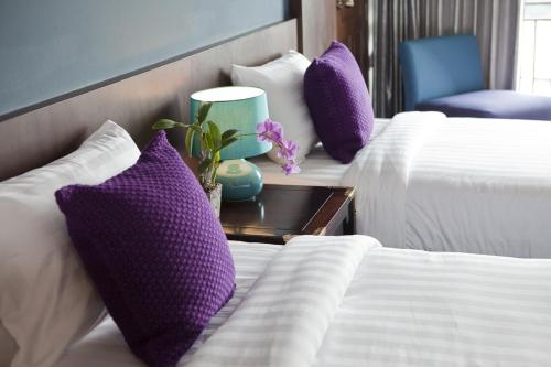 Cama o camas de una habitación en Bonito Chinos Hotel