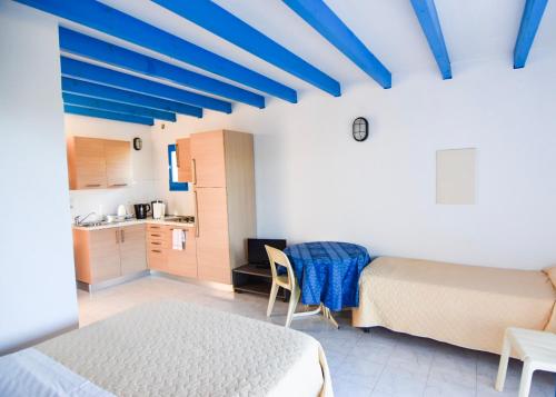 Ένα ή περισσότερα κρεβάτια σε δωμάτιο στο Cala di Sole