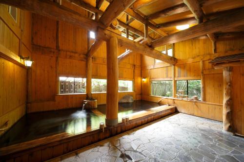 an inside view of a large wooden building with windows at Yumoto Choza in Takayama