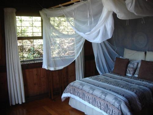 Posteľ alebo postele v izbe v ubytovaní House 53 Sodwana Bay Lodge