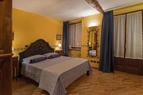 Postel nebo postele na pokoji v ubytování B&B Contrada dei Giardini