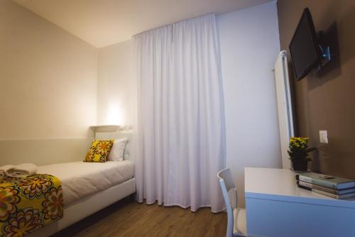 Кровать или кровати в номере Angelina Rooms in Rome