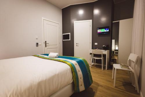 Кровать или кровати в номере Angelina Rooms in Rome