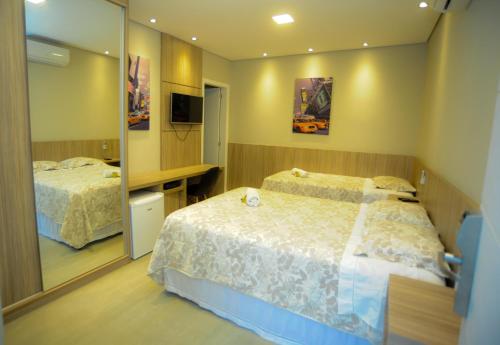 Postel nebo postele na pokoji v ubytování Cynn Hotels