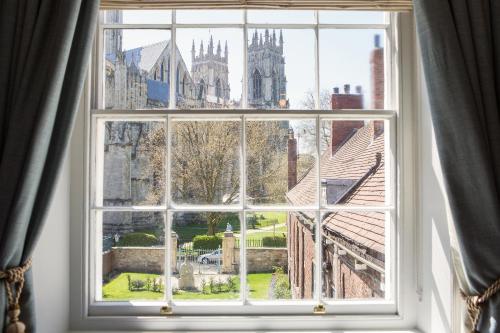 a window with a view of a city at Grays Court Hotel in York