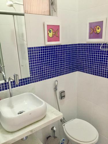 a bathroom with a sink and a toilet at Melhor de Ipanema in Rio de Janeiro